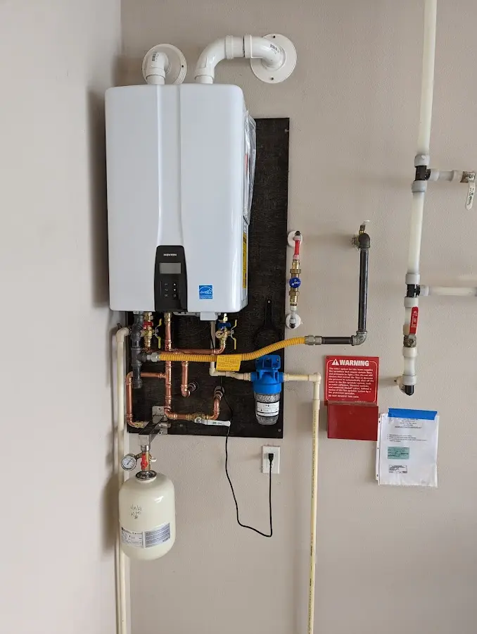 Professional plumber installing copper piping in a Rio Dell home